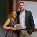 John Rimoldi presents Maria Alvim Gaston with an award plaque