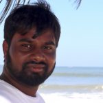 Praveen Kolimi with beach as his background